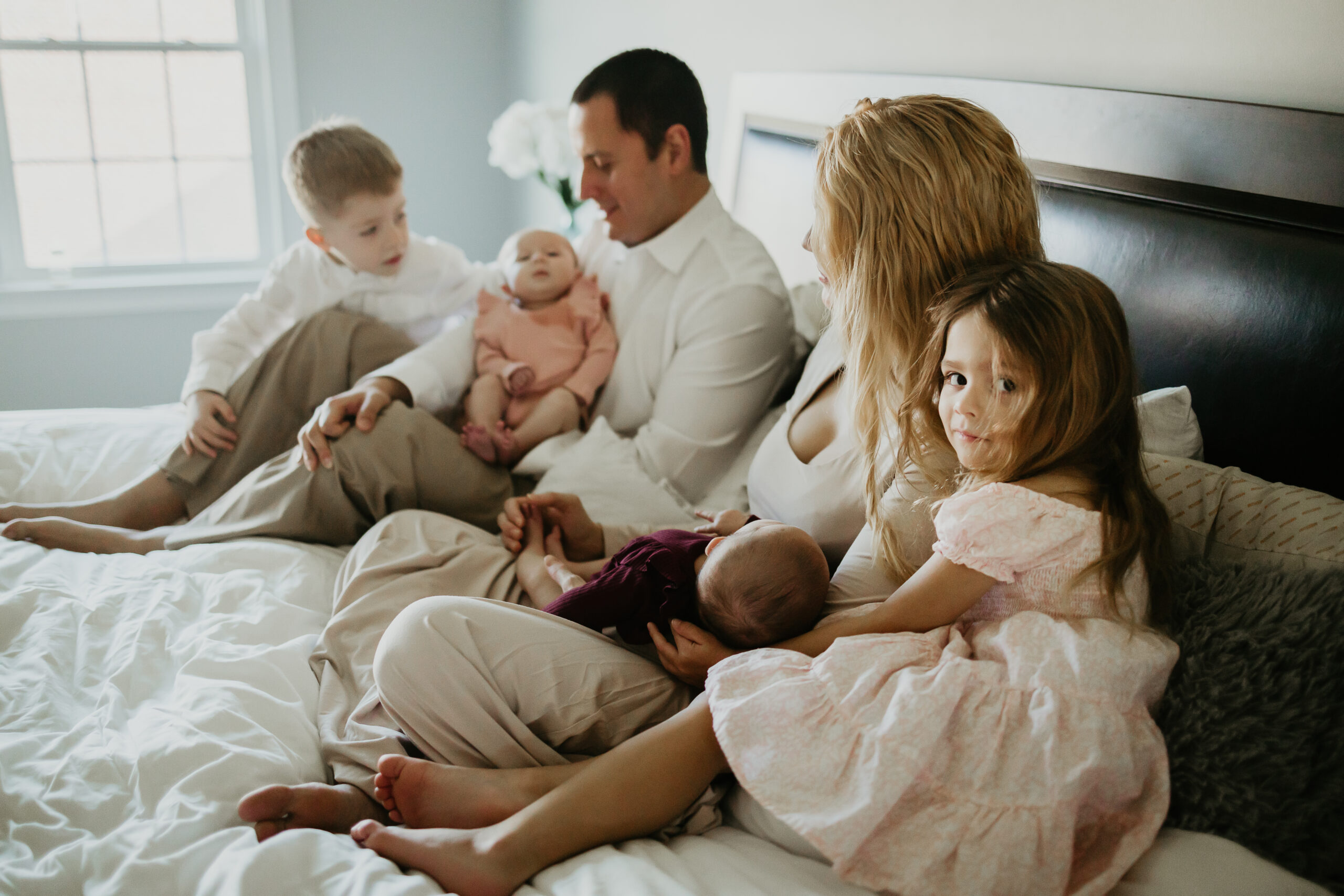 Family at home with children and newborn